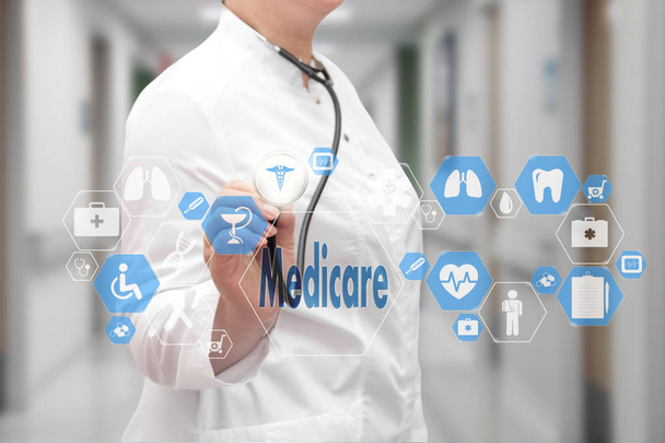 Medical Doctor with stethoscope and Medicare icon in Medical net - Photo, Image