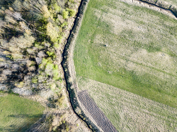 drone image. aerial view of rural area with wawy river ion fores - Photo, Image