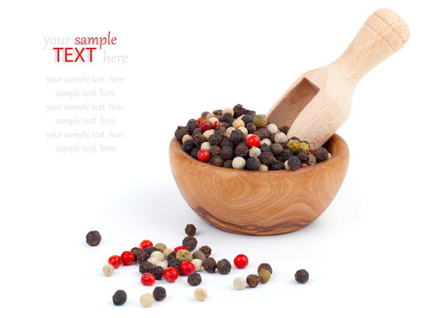Colored Pepper in the wooden bowl, on the white background - Photo, image