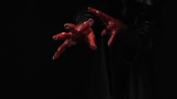 Bloody hands on black background - Footage, Video