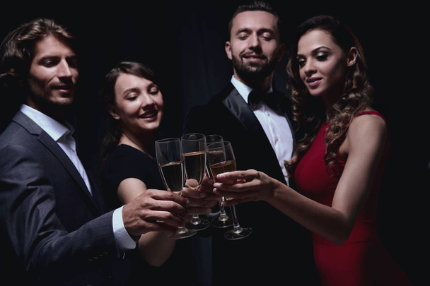 Cheerful people celebrating a sucess with Champagne - Фото, изображение