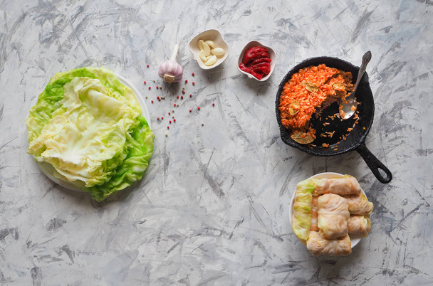 Cooking cabbage rolls stuffed with rice and vegetables, top view.  - Photo, Image