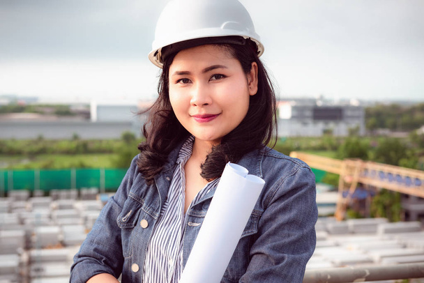 Portrait of female Civil Engineer in fabrication yard of factory - Photo, Image