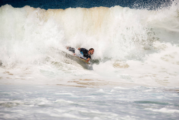 A surfer who surfers a big wave - Photo, Image