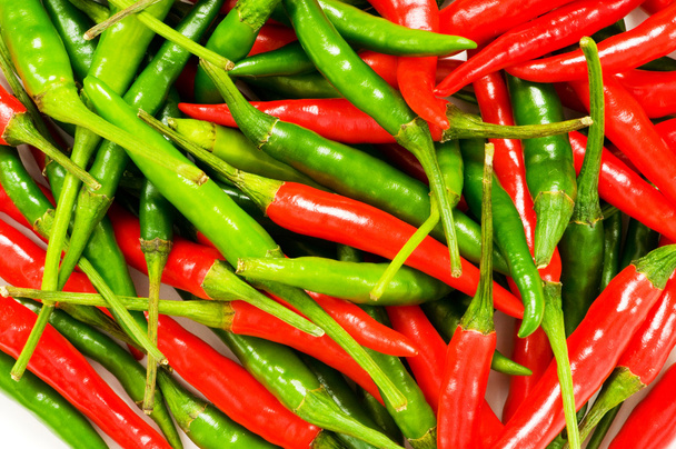 Red and green chili peppers - Фото, изображение