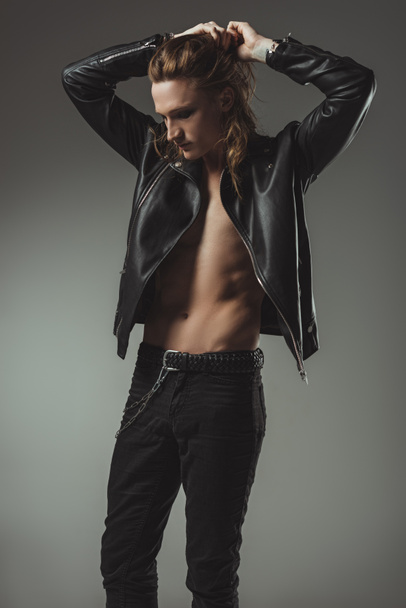 Handsome Shirtless Rocker With Long Hair Posing Free Stock Photo and Image