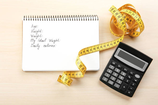 Measuring tape, calculator and notebook - Fotografie, Obrázek