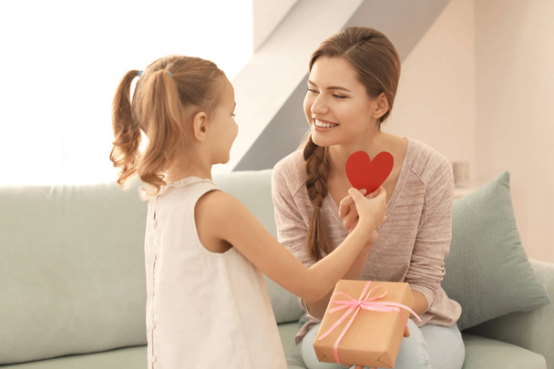 Cute girl greeting mother - Photo, Image