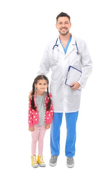 Children's doctor with little girl on white background - Фото, изображение