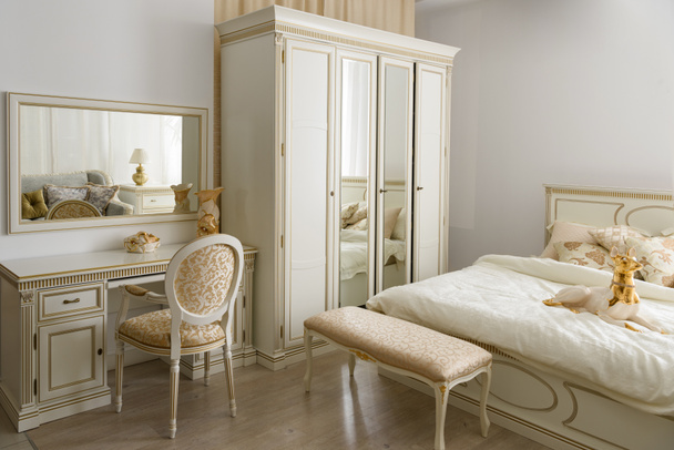 Elegant dressing table by bed in stylish room - Photo, Image