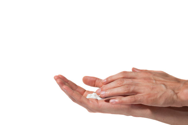 Male working hands put on a moisturize cream for soft skin isolated on a white background, beauty and health care concept - Zdjęcie, obraz