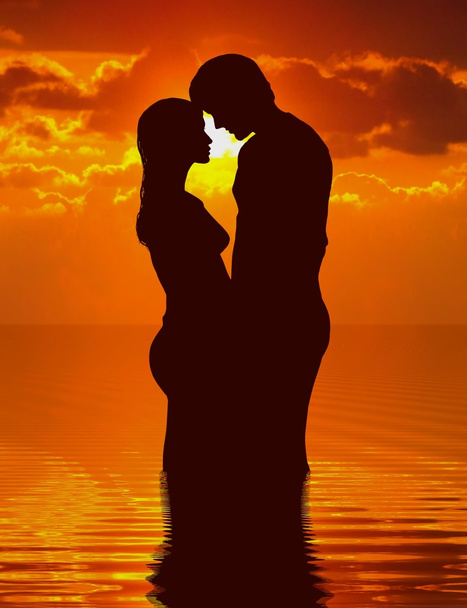Loving couple under sunset - Photo, Image