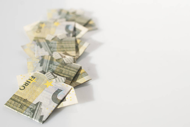 Finance concept: a row of men made with 5 euro bills folded like - 写真・画像