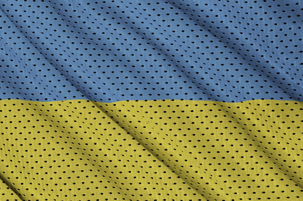 Ukraine flag printed on a polyester nylon sportswear mesh fabric - Foto, afbeelding
