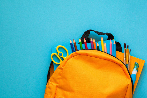 Back to school concept. Backpack with school supplies. Top view. Copy space - Valokuva, kuva