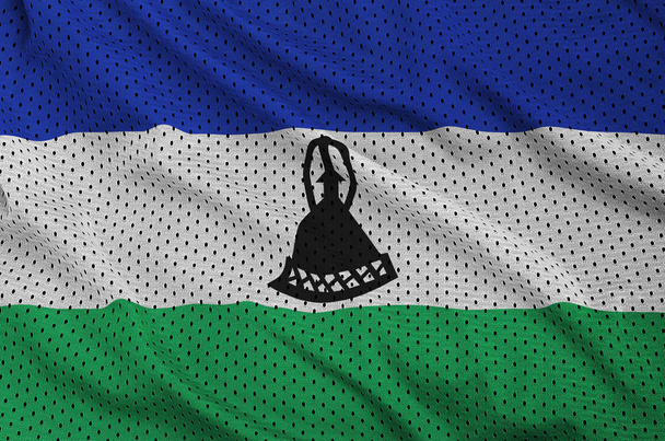 Lesotho flag printed on a polyester nylon sportswear mesh fabric - Photo, Image