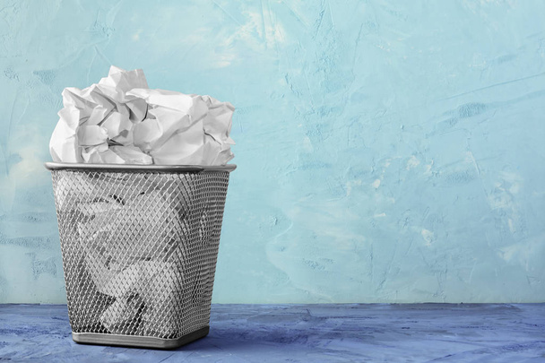 A trash can for paper. Beautiful background with place for text. A full trash can for crumpled paper sheets. - Φωτογραφία, εικόνα