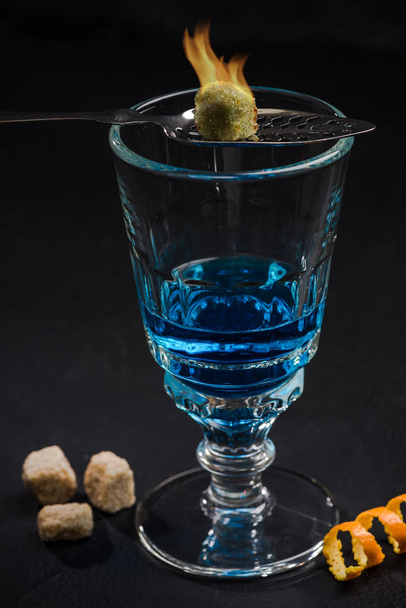 Absinthe blue shoot in crystal glass - 写真・画像