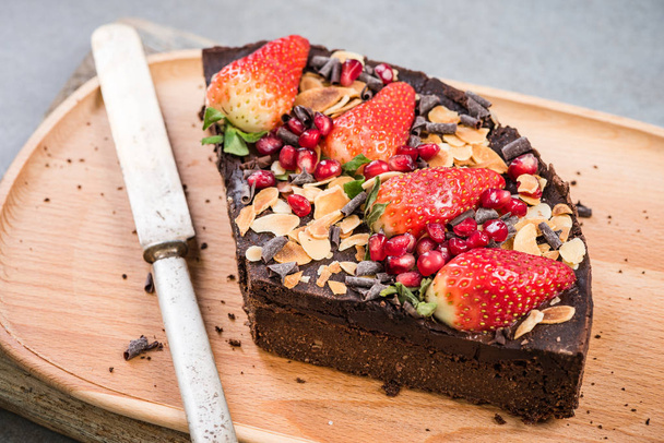 Slice of healthy brownie with strawberry  - Photo, Image