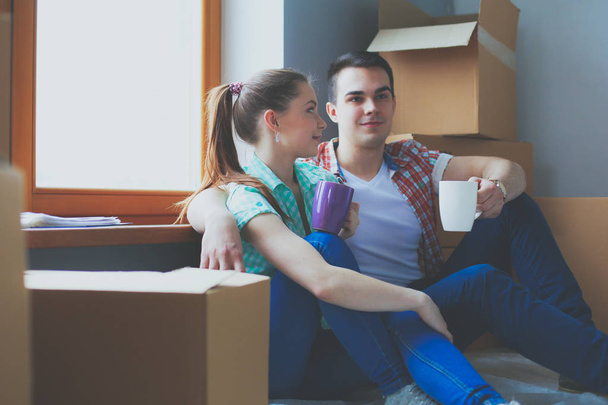 Couple moving in house sitting on the floor. Couple - Foto, Imagem
