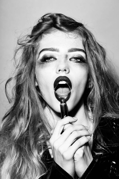 Pretty woman with lipstick in mouth - Φωτογραφία, εικόνα