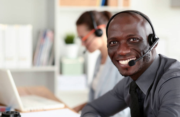 Portrait of an African American young business man with headset. - Foto, Imagem