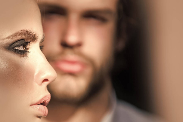 Woman face profile with blurred man on background - Valokuva, kuva