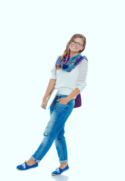 Smiling teenager with laptop on white background. Student. - Foto, Bild