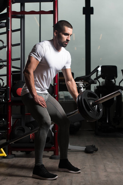 Muscular Man Exercising Back With Barbell - Foto, Imagem