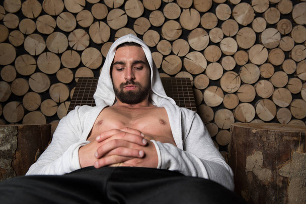 Portrait Of A Muscular Man Relaxing In Sauna - Photo, Image
