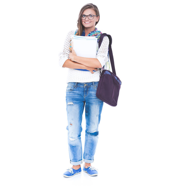 Portrait of a young student woman holding exercise books. - Foto, Imagen