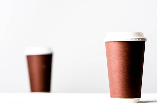 Takeout coffee cup on white. Brown paper cups isolated. - Zdjęcie, obraz