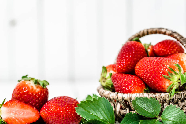 Fresh strawberries in the basket, berry fruits on farmer market - Фото, изображение