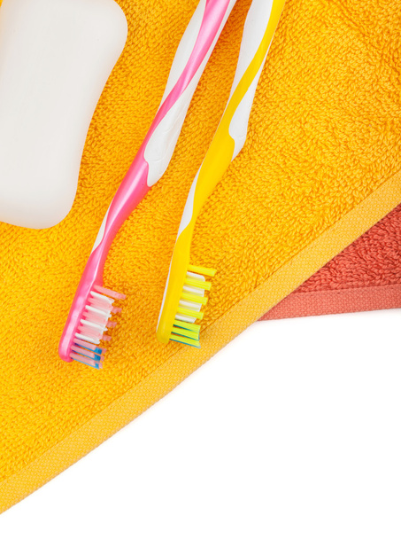Toothbrushes, soap and two towels - Photo, Image