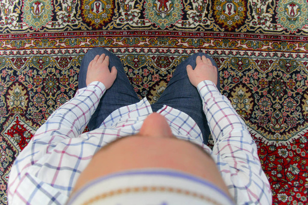 Young muslim man praying inside of beautiful mosque - Фото, зображення