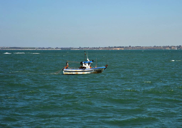 CADIZ, SPAIN - JULY 8, 2011: Fishing boat off the coast of the sea town of Cadiz. - Valokuva, kuva