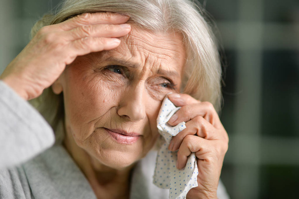 close-up portrait of stressed senior woman crying  - Фото, зображення