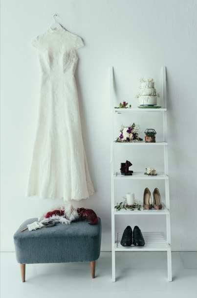 close up view of bridal and grooms clothing and accessories for rustic wedding in room - Photo, Image