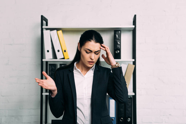 portrait of stressed businesswoman standing in office - Photo, Image