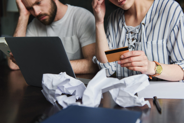 cropped shot of young couple counting bills together - Photo, Image