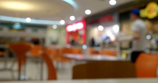Defocused background of food court or coffee shop with people moving fast along timelapse - Footage, Video