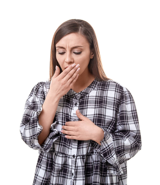 Young woman coughing on white background - Foto, Bild