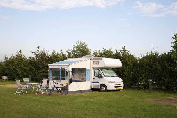 Motor home parked at a camping in the Netherlands - Foto, afbeelding
