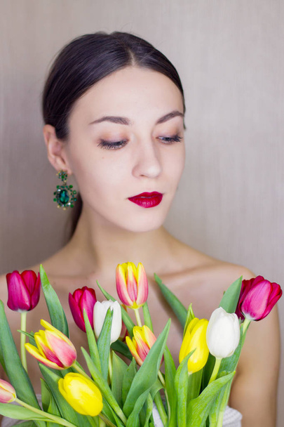 Beautiful young women with tulips - Фото, зображення
