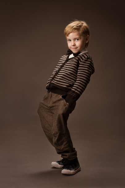 Boy over brown background. Vintage style. Kids fas - Fotoğraf, Görsel