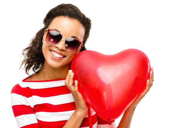 Valentines day portrait of Pretty Mixed race woman holding red heart - Foto, Imagen
