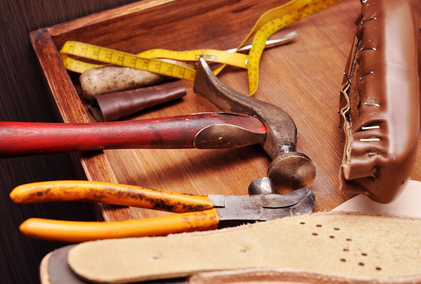 Shoemaker tools. Shoemaker workshop. The hammer of a shoemaker. Hammer shoemaking. - Photo, Image