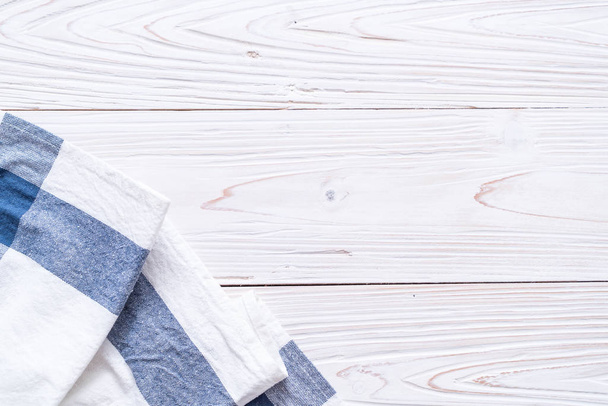 kitchen cloth (napkin) on wood background - 写真・画像