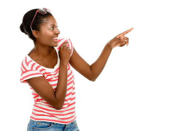 Happy African American woman pointing on something isolated on white - Valokuva, kuva