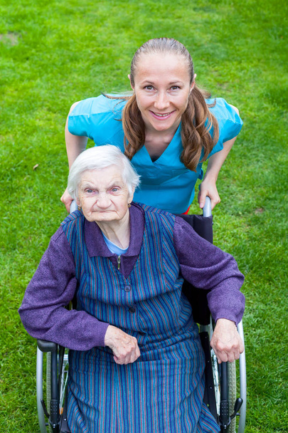 Spending time outdoor with caregiver - Photo, Image